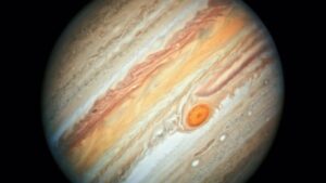 Jupiter planet with its iconic Great Red Spot and colorful atmospheric bands in deep space.