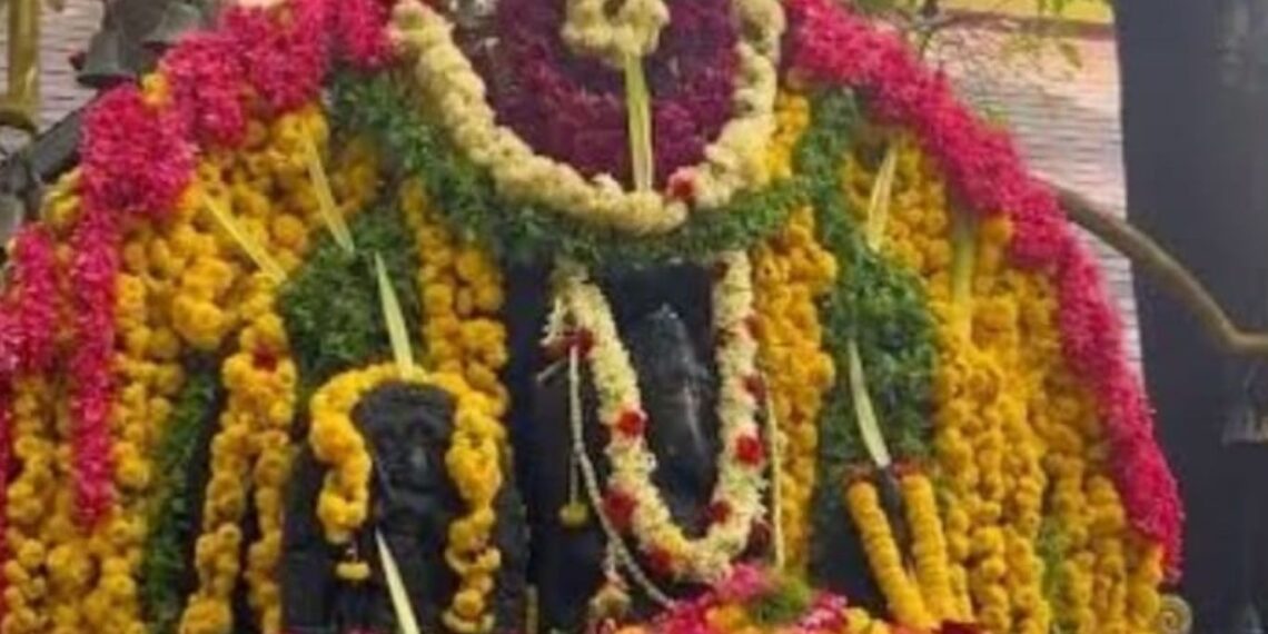 Southadka Mahaganapathi Temple with thousands of bells hanging and Ganesha idol in open air.
