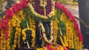 Southadka Mahaganapathi Temple with thousands of bells hanging and Ganesha idol in open air.