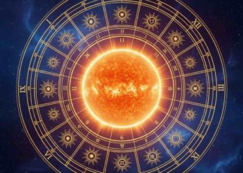 A mystical and glowing golden sun at the center of a celestial zodiac wheel with twelve astrological houses, set against a deep cosmic star-filled background.