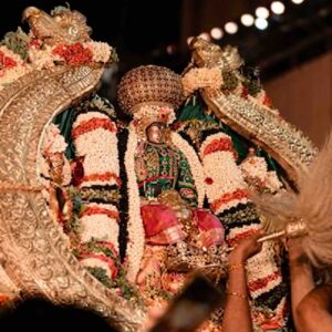 HD image of Lord Cheluvanarayana Swamy adorned with the Vairamudi diamond crown, riding the Garuda vahana during a night procession at Melukote temple.