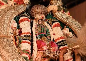 HD image of Lord Cheluvanarayana Swamy adorned with the Vairamudi diamond crown, riding the Garuda vahana during a night procession at Melukote temple.