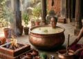 A Vedic ritual scene showing a person submerged up to the neck in Panchagavya inside a large copper vessel, with priests performing a homam nearby.