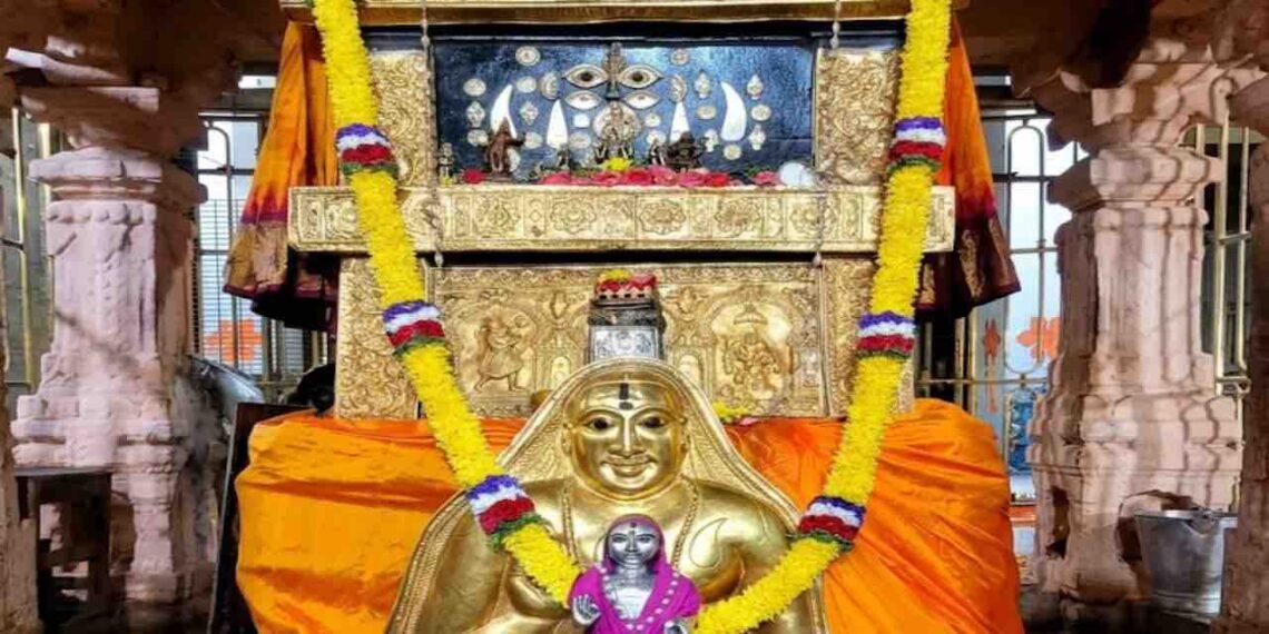 The sacred Moola Vrundavana of Sri Raghavendra Swamy in Mantralaya, adorned with a golden kavacha, flower garlands, and traditional offerings.