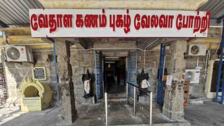 Main entrance of Sri Kandaswamy Temple in Cheyyur, Chengalpattu, featuring stone pillars and Tamil signage.