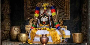 Runa Vimochana Lingeswarar Kadan Nivartheeswarar Shiva Lingam at Thirucherai Temple decorated with garlands and traditional attire.