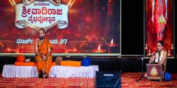 Sri Vishwavallabha Tirtha Swamiji of Sode Mutt and Dr. Prandeva Upadhyaya on stage at Vadiraja Vaibhavotsava in Hoovinakere.