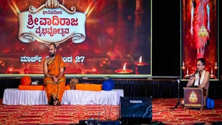 Sri Vishwavallabha Tirtha Swamiji of Sode Mutt and Dr. Prandeva Upadhyaya on stage at Vadiraja Vaibhavotsava in Hoovinakere.