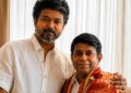 Actor Vijay posing with astrologer Radhan Pandit during an indoor meeting