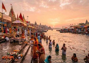 AI generated image of Yamuna River Pushkaram festival featuring devotees taking holy dip, traditional temples, and evening aarti oil lamps floating on the water during sunset.