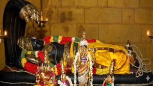 A detailed view of the reclining idol of Lord Parimala Ranganathar resting on the serpent Adi Shesha.