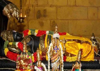 A detailed view of the reclining idol of Lord Parimala Ranganathar resting on the serpent Adi Shesha.