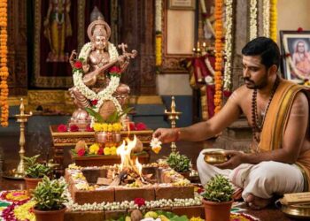 Hindu groom performing Gandharvaraja Homa with sacred fire and white flowers dipped in honey for early marriage.
